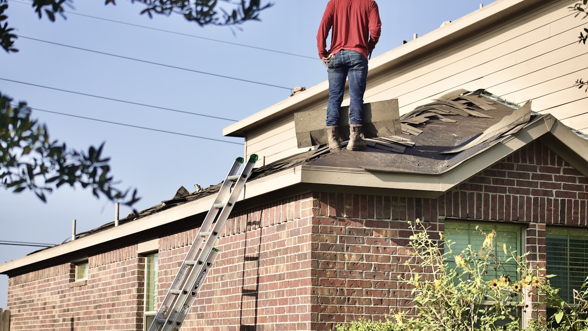 Roofing contractor working on a residential roof in Fort Lauderdale